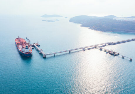 Aerial view of Modern sea harbor with transhipment equipment for oil tankers - Jetty Line